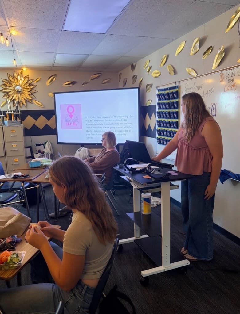 HER students in matching pink shirts at a Welcome Back meeting
